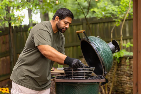 Placing the charcoal in green egg grill