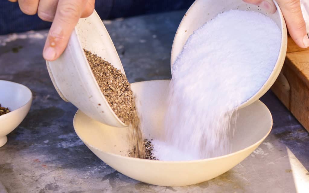 Frozen Chicken Breast Air Fryer: a mixing bowl, combine a mixture of coarse kosher salt, coarsely ground black pepper