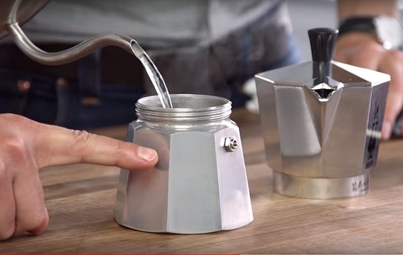 Fill the bottom chamber of your Moka pot with water in making cuban coffee