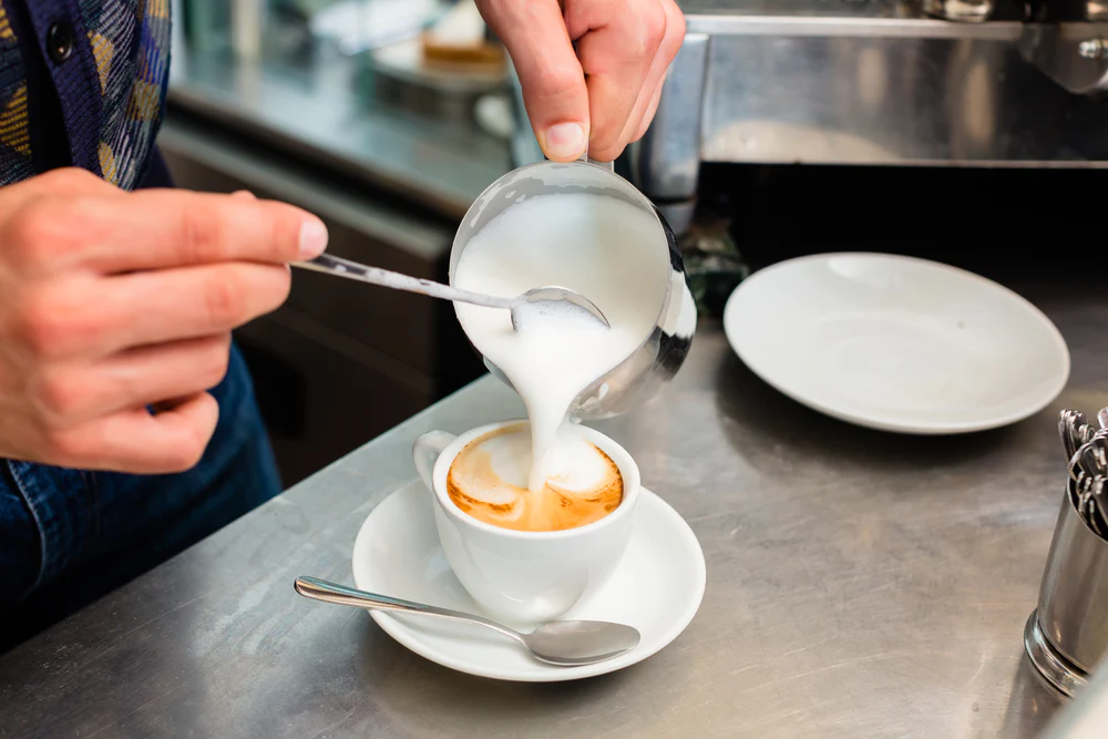 frothing milk using your demitasse spoon.