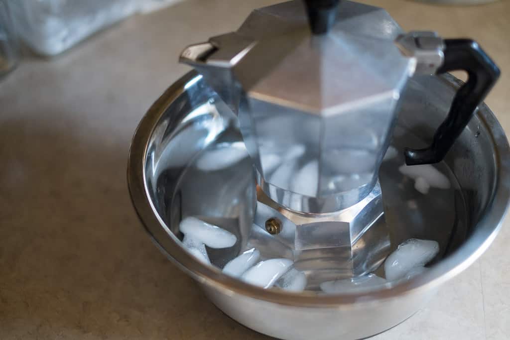 moka pot bottom chamber in a cold water bath